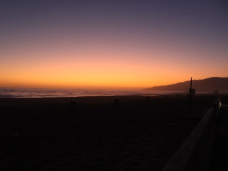 A Sunset Over A Beach