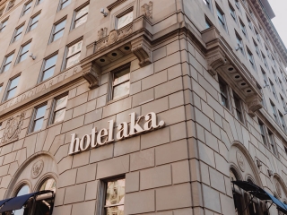 A Tall Building With A Sign On It