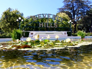 A Building With A Sign Over A Pond