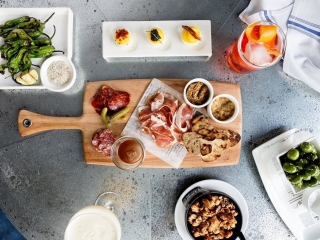 A Table With Food And Drinks On It
