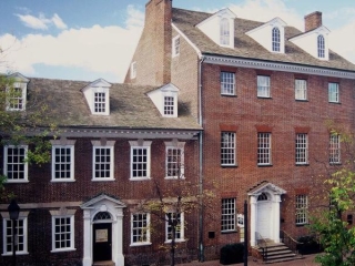 A Brick Building With Trees In Front Of It