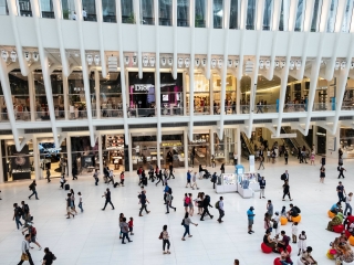 A Large Group Of People In A Large Building