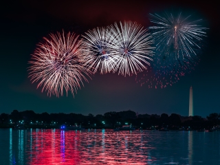 Fireworks Over A Body Of Water