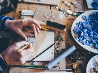 A Person Painting On A Table