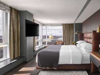 A Bedroom With A Large Window