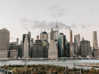 A City Skyline With A River