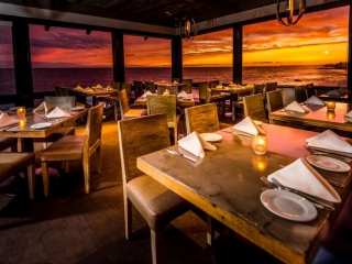 A Restaurant With Tables And Chairs