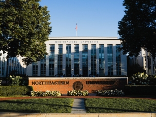 A Large White Building With A Flag On Top