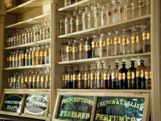 A Shelf With Many Bottles Of Alcohol On It