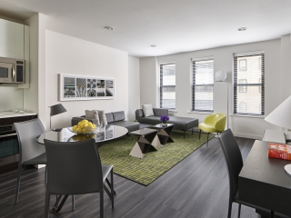 A Living Room Filled With Furniture And A Large Window