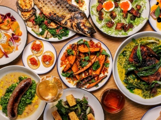 A Table Full Of Plates Of Food