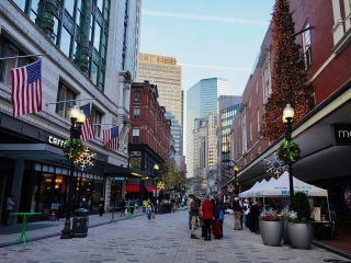 A Street With Buildings And People