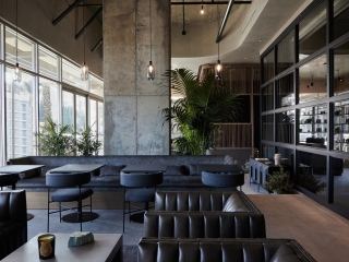 A Room Filled With Furniture And A Large Window