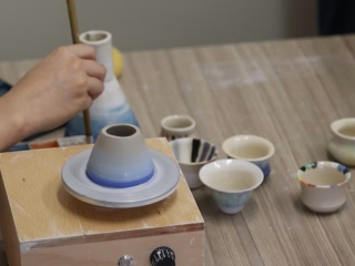 A Hand Holding A Cup Of Coffee