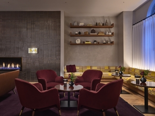 A Room With A Table Chairs And Shelves With Objects On Them
