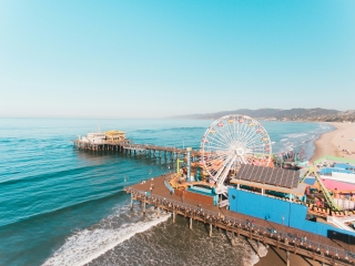 A Large Amusement Park Next To A Beach