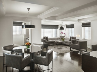 A Living Room Filled With Furniture And A Large Window