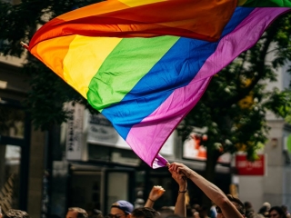 A Group Of People Holding Flags