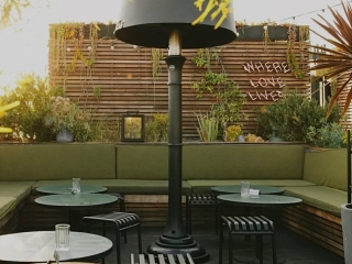 A Patio With Tables And Chairs