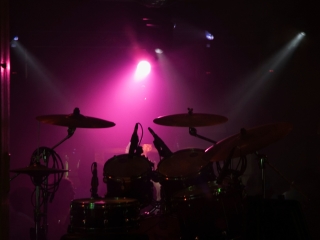 A Drum Set With A Microphone
