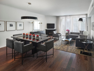 A Room With A Table And Chairs