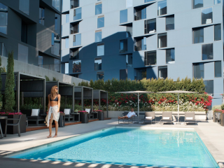 A Person Standing Next To A Pool