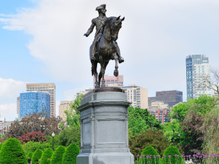 A Statue Of A Person Riding A Horse
