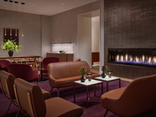 A Room With A Large Screen And Chairs