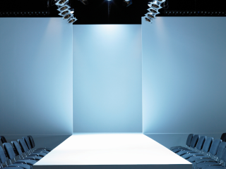 A Room With A Large Projector Screen And Chairs