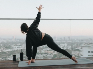 A Person Doing Yoga On A Roof